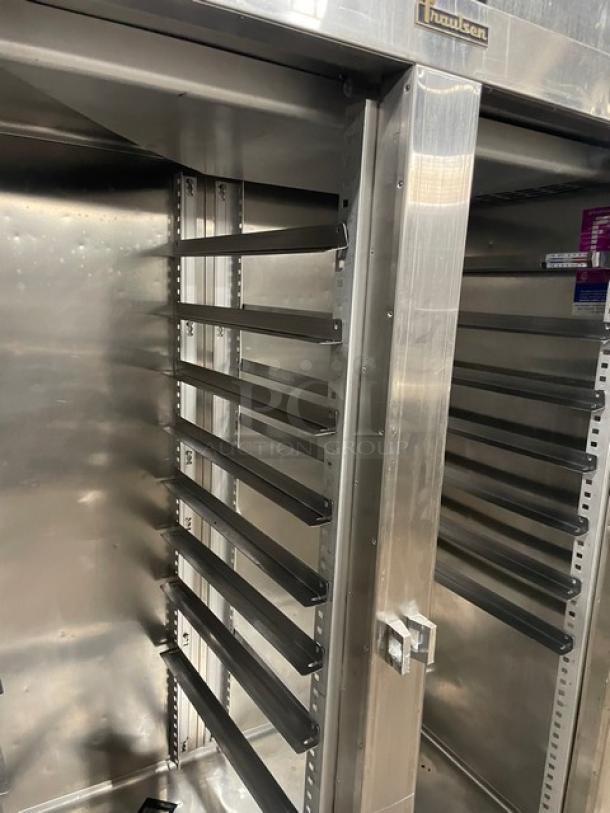 Traulsen stainless steel two-door freezer, Model 1RLT232NUT1, with built-in pan slides, excellent condition.