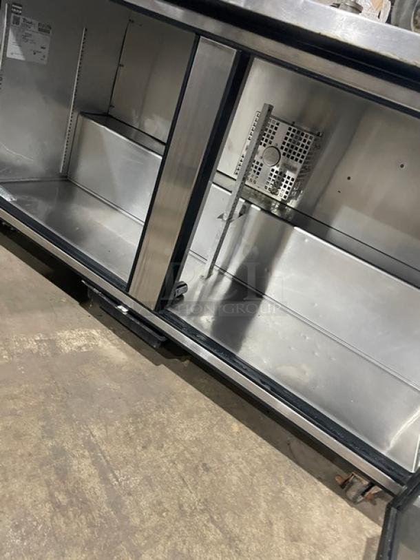True TUC-60F stainless steel two-door under counter worktop freezer with casters, 115v, SN 9131259, shown open, commercial use.