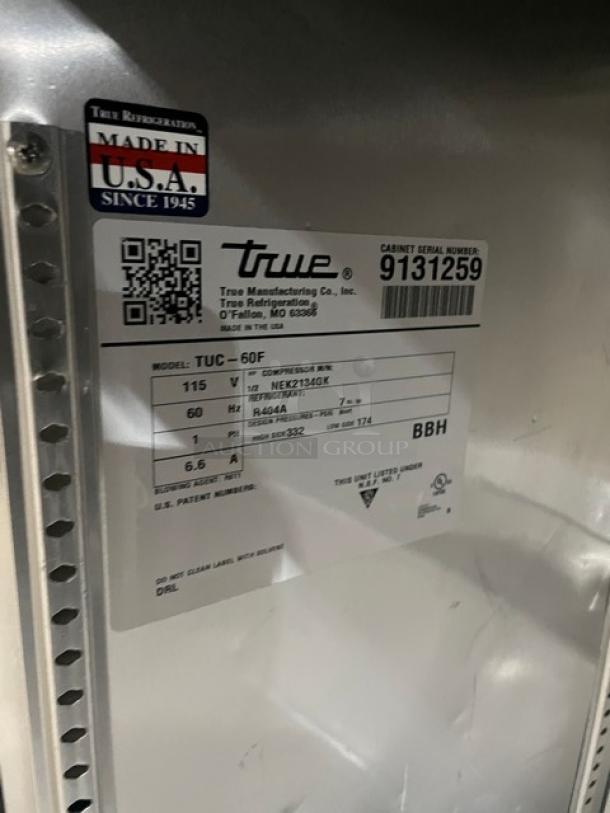True TUC-60F commercial stainless steel two-door under-counter freezer, model SN 9131259, 115V, Made in USA label.