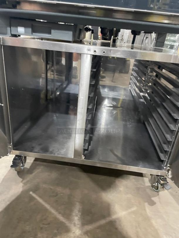 Unox ChefTop MIND.Maps Plus combi oven, model XAVC-06FS-EPR, with stainless steel enclosed pan rack on casters.