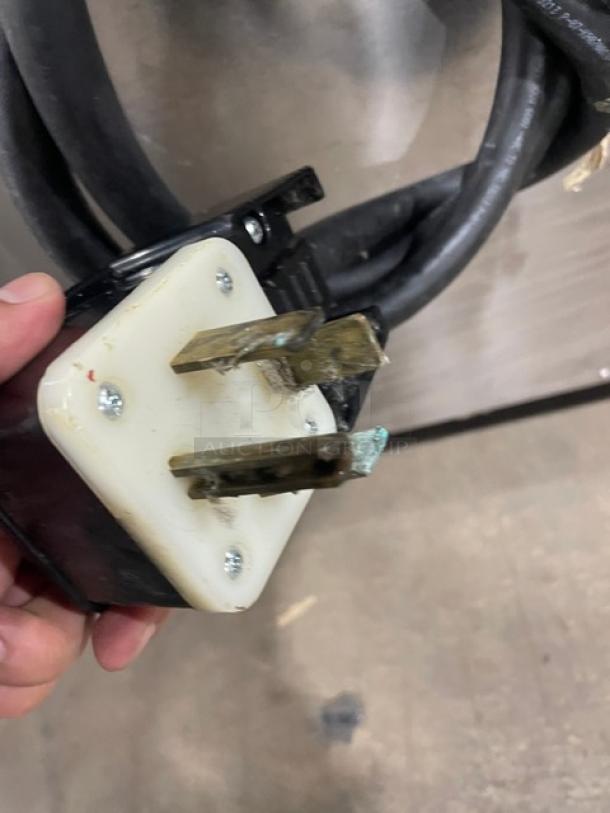 Unox ChefTop MIND.Maps Plus Series combi oven plug, worn prongs, white base, connected to black power cord.