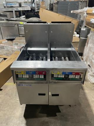 Pitco Solstice Supreme SSH55 commercial fryer, stainless steel, 2-bay, 50lb capacity, natural gas, with backsplash, on casters.