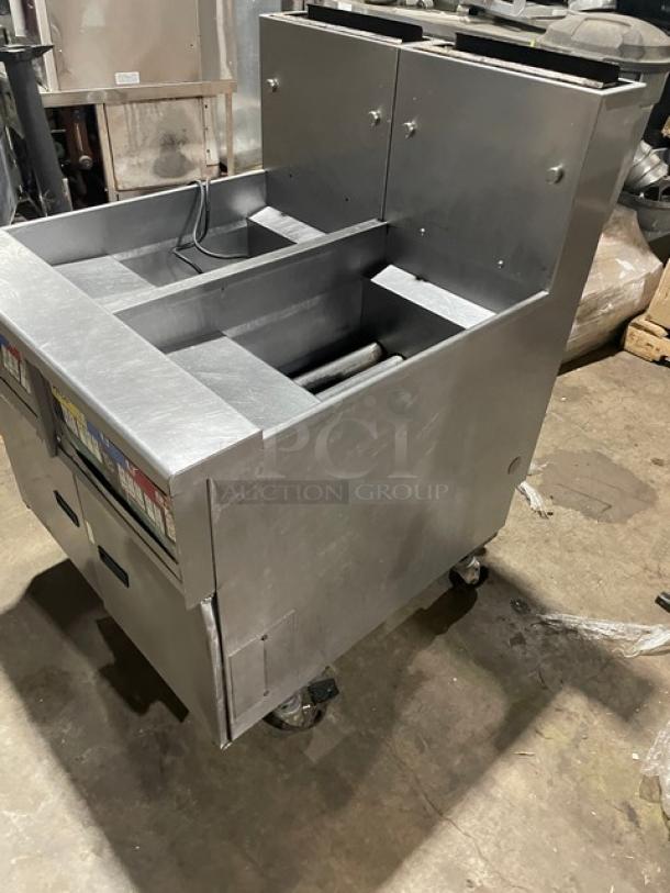 Pitco Solstice Supreme SSH55 dual-bay fryer, stainless steel, natural gas, 50lb capacity, with back splash, on casters.