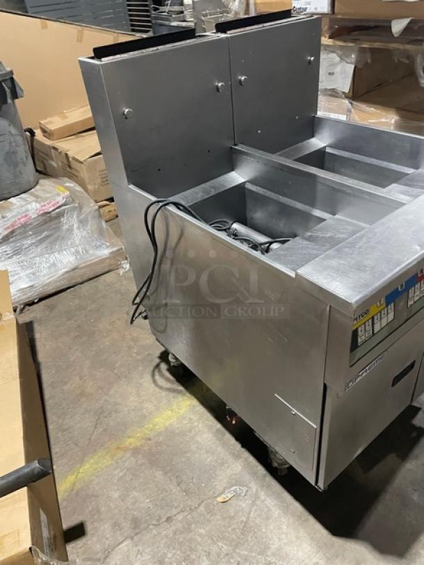 Pitco Solstice Supreme SSH55 stainless steel 2-bay deep fat fryer, natural gas, 50lb capacity, with back splash, on casters.