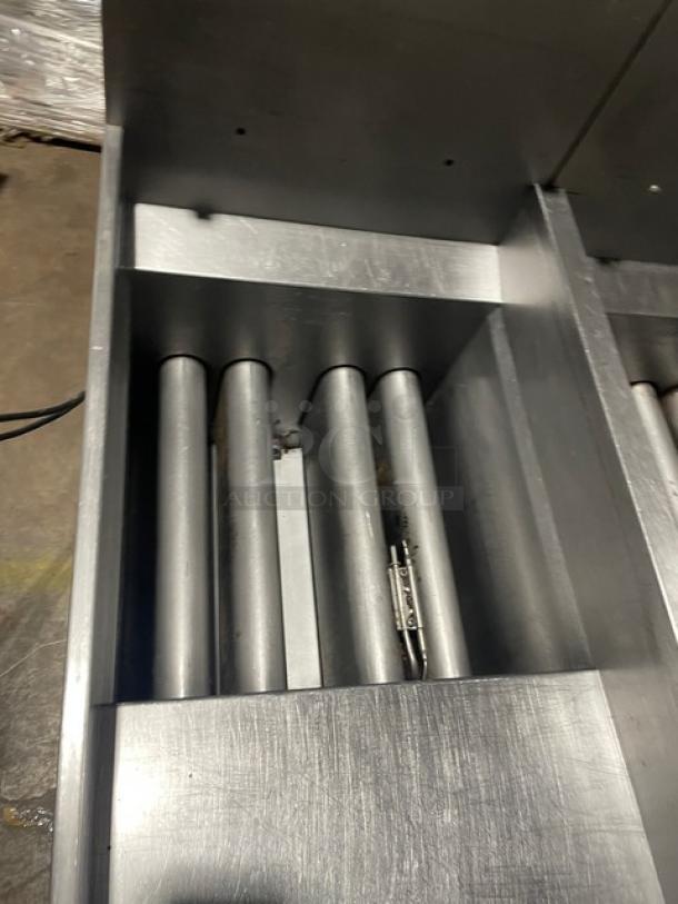Pitco Solstice Supreme Series SSH55 2-bay deep fat fryer, stainless steel, natural gas, 50 lb capacity, with backsplash, on casters.
