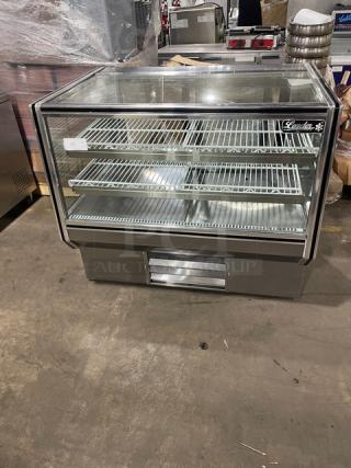 Leader stainless steel refrigerated bakery display case with straight glass front and poly-coated wire racks.