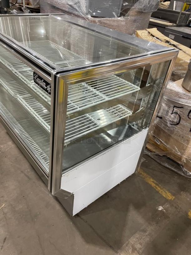 Leader commercial stainless steel bakery display case with straight glass. Features adjustable poly-coated wire racks.