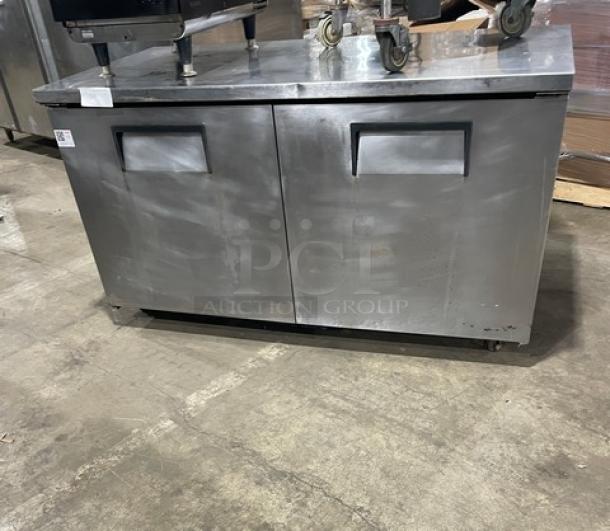 True TUC-60F commercial stainless steel two-door under counter freezer, with casters, Model No. 9131259, 115v, 1 phase.
