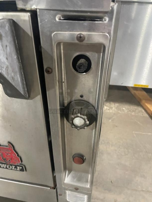 Wolf commercial stainless steel 4-burner range/oven combo, natural gas powered, includes backsplash, wire oven rack, working condition.