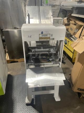 Oliver Model 79732NC electric bread slicer, white, stainless steel worktop, on casters, 115V, gravity feed, SN: 164680.
