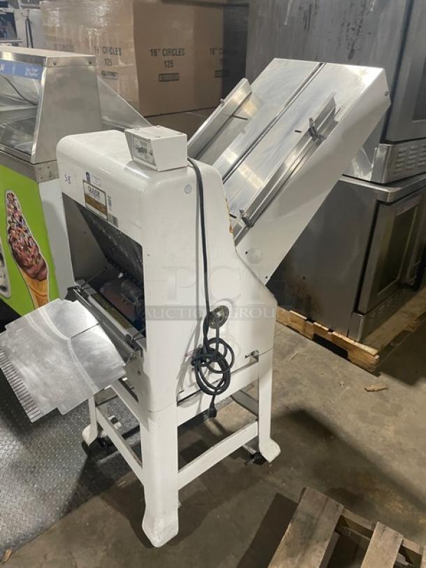 Oliver Model 79732NC commercial white electric bread slicer, stainless steel worktop, gravity feed, 115V, on casters.