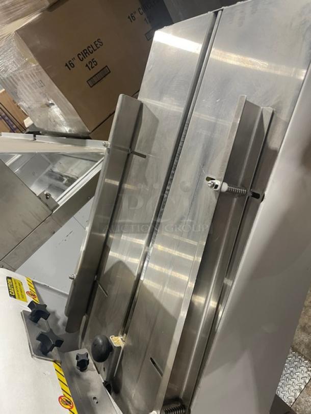 Oliver Model 79732NC bread slicer with stainless steel worktop. Electric, gravity feed, free-standing, on casters, 115V.