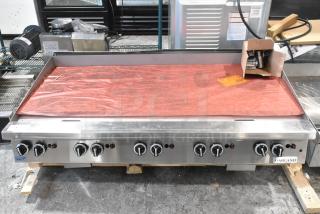 Brand new Garland stainless steel griddle, natural gas, countertop model. Scratch and dent condition, six control knobs, with accessories.