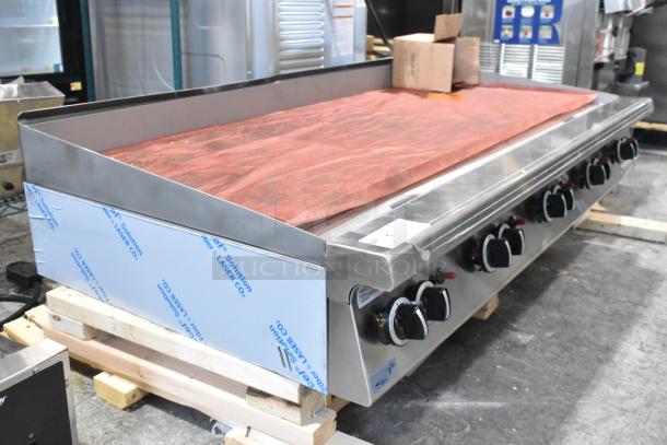 Brand new Garland stainless steel commercial countertop flat top griddle, natural gas powered, minor scratches, protective finish.