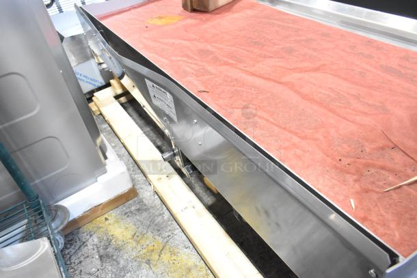 Brand new Garland stainless steel commercial countertop natural gas griddle, visible scratch and dent, with manufacturer label.