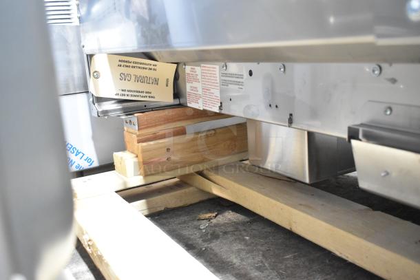 Brand new Garland stainless steel commercial natural gas flat top griddle, scratch and dent condition, uninstalled.