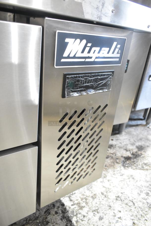 Brand new Migali C-CB72-76-HC stainless steel 4-drawer chef base, commercial casters, 115V, slight scratches.