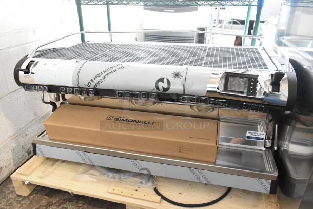 Brand new Nuova Simonelli Aurelia Wave 3 Group Espresso Machine, stainless steel, volumetric, 2 steam wands, boxed.