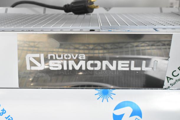 Nuova Simonelli Aurelia Wave 3 Group Espresso Machine, stainless steel, new condition, with logo and visible wiring.