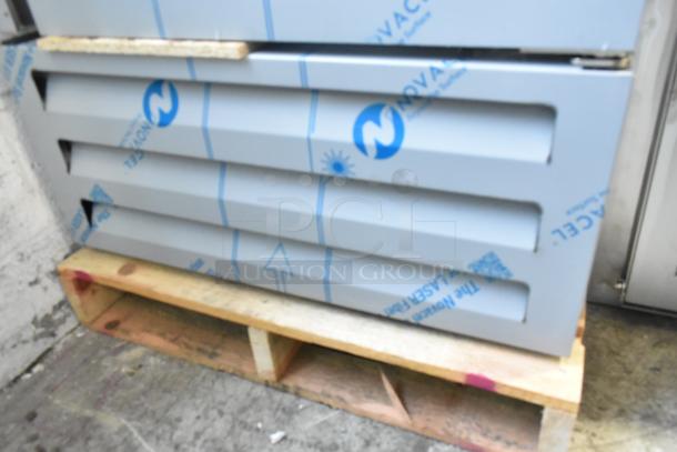 Brand new 2025 Avantco 447AP23R stainless steel cooler on wooden pallet, scratch and dent, wrapped in protective film.