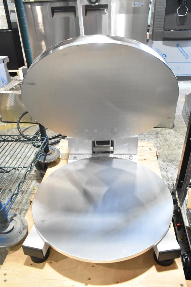 Brand new Estella 348DPC18NH clamshell pizza dough press, 18", manual operation, no heat, minor scratches visible.