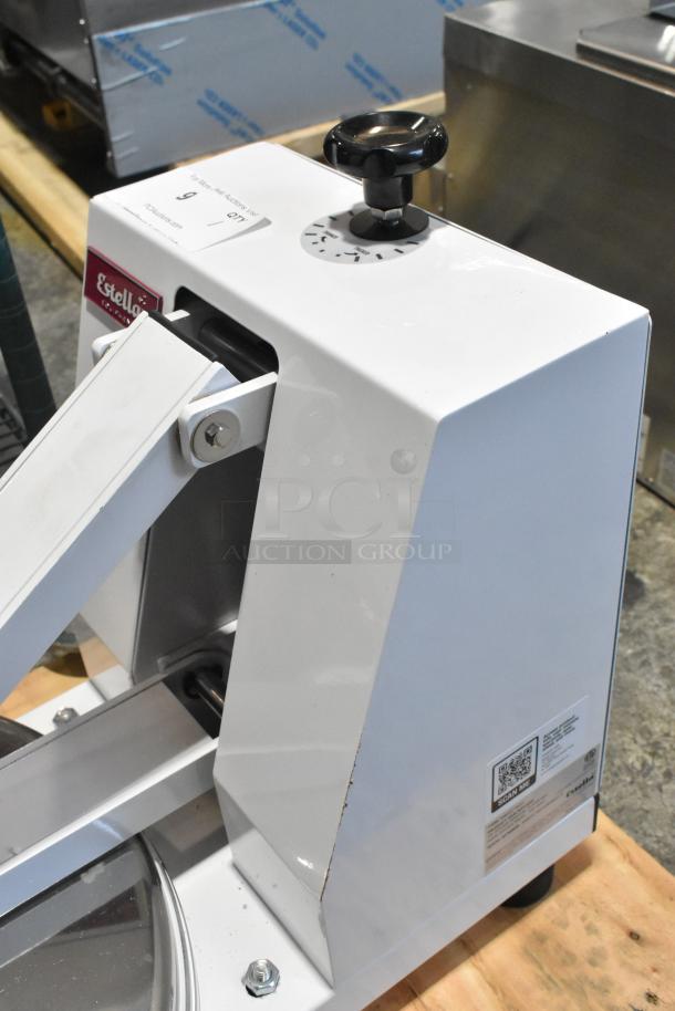 Brand new Estella 348DPC18NH 18" manual clamshell pizza dough press, no heat. Slight scratches, dented corner visible.