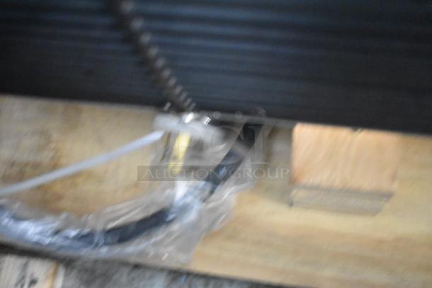 Blurred image showing part of the Avantco 193VOA48B 47" black open-air merchandiser's base. See item details for condition.