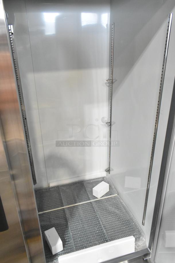BRAND NEW Avantco 178A49RHC stainless steel 2-door cooler, 2024 model. Visible interior shelving and protective wraps.