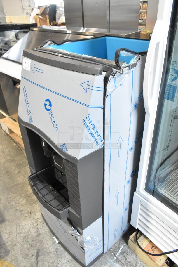 Brand new Manitowoc SPA162-161 22" Touchless Ice Dispenser, 120 lb. capacity, visible scratches and dents, 115 volts, 1 phase.