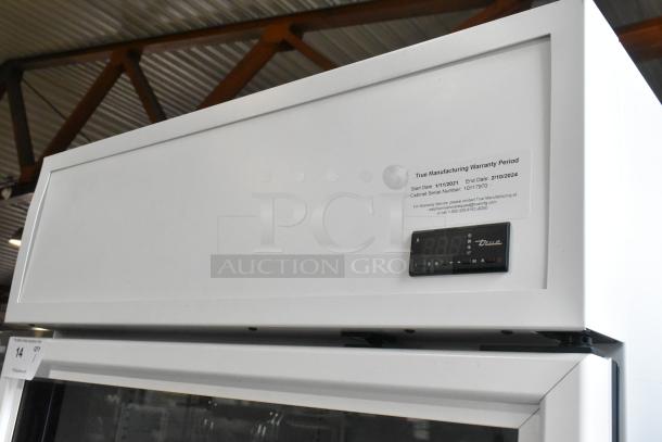 BRAND NEW SCRATCH AND DENT 2021 True TSCI-600R-G-PH metal cooler with single glass door, digital display, and warranty label.