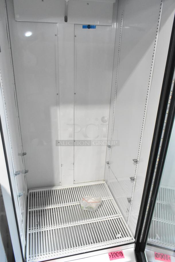 True TSCI-600R-G-PH single door cooler, brand new with minor scratches, features poly-coated racks, 115V, 1 Phase.