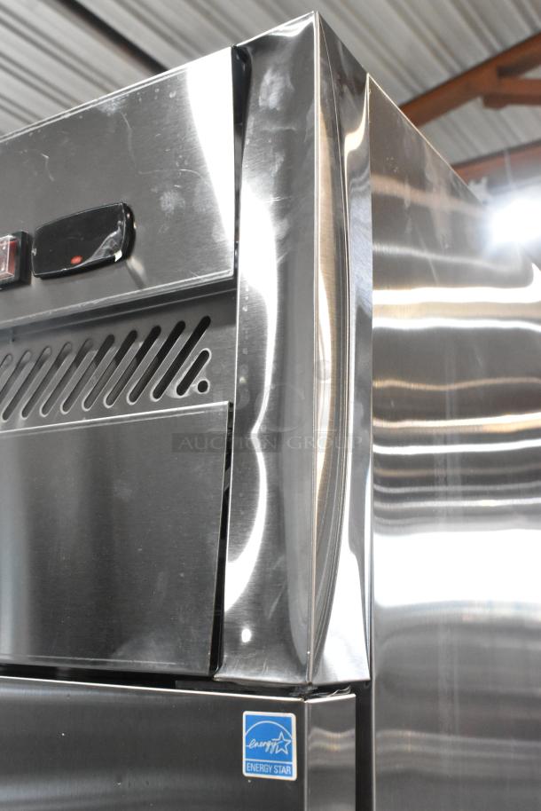 Brand new Avantco 178Z2RHC stainless steel 2-door cooler with scratches, dents, and Energy Star label on commercial casters.