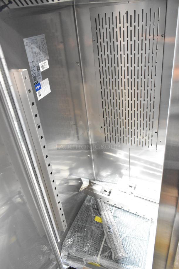 BRAND NEW scratch and dent Avantco 178Z2RHC stainless steel 2 door reach-in cooler, visible interior, commercial casters.