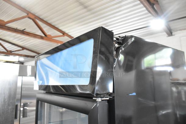 Brand new scratch and dent Mainstreet 829GMC12B black swing glass door commercial refrigerator, 115V, minor top dent visible.