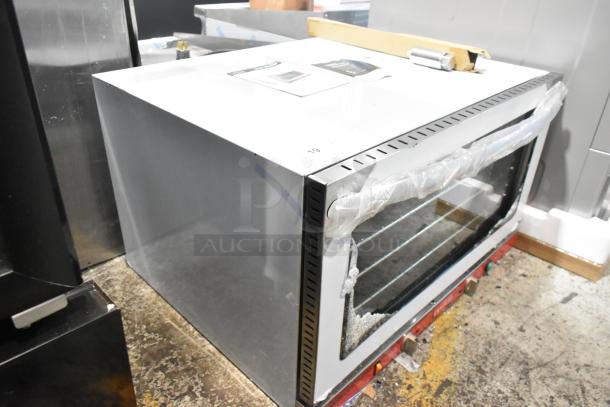 Brand new Avantco 177CO46M stainless steel convection oven, 4.4 cu. ft., with broken glass, 208/240V, countertop model.