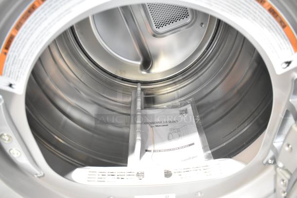 BRAND NEW Crossover DLHS0817EC2 7 cu. ft. Front Load Electric Dryer interior with manual, scratch and dent condition.