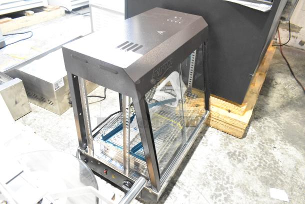 Brand new Avantco 177HDC26 heated display case, 3 shelves, sliding doors, 120 volts, 1 phase. Scratch and dent condition.