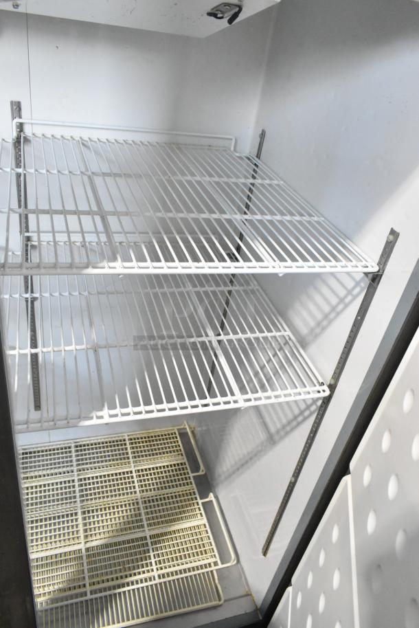 Central 69K-032HC stainless steel 2-door cooler with poly-coated racks, shown open. 115 volts, 1 phase. Clean condition.