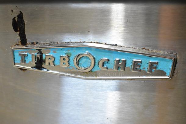 2019 Turbochef i3-DL stainless steel rapid cook oven with worn logo plate. 208/240V, 3 phase, commercial countertop model.
