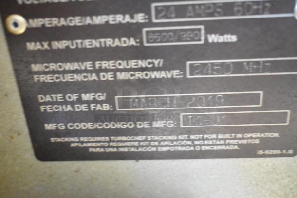 Label on a 2019 Turbochef i3-DL stainless steel rapid cook oven, showing manufacturing date and microwave frequency details.