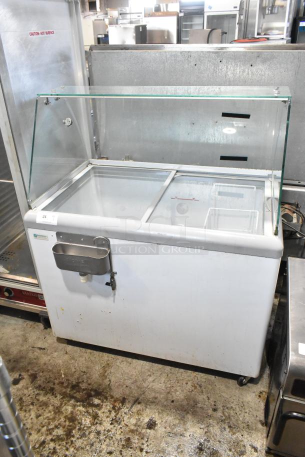 Excellence HL-11HC commercial chest freezer with sneeze guard, metal body, 115V, 1 phase, condition shows signs of use.