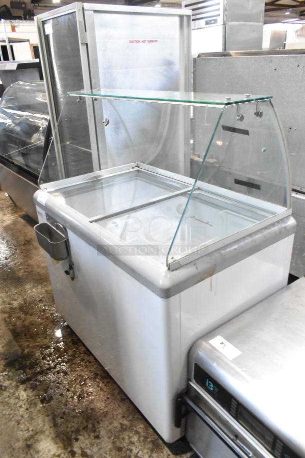 Excellence HL-11HC Metal Commercial Chest Freezer with sneeze guard, 115V, 1 Phase, silver, good condition, visible safety label.