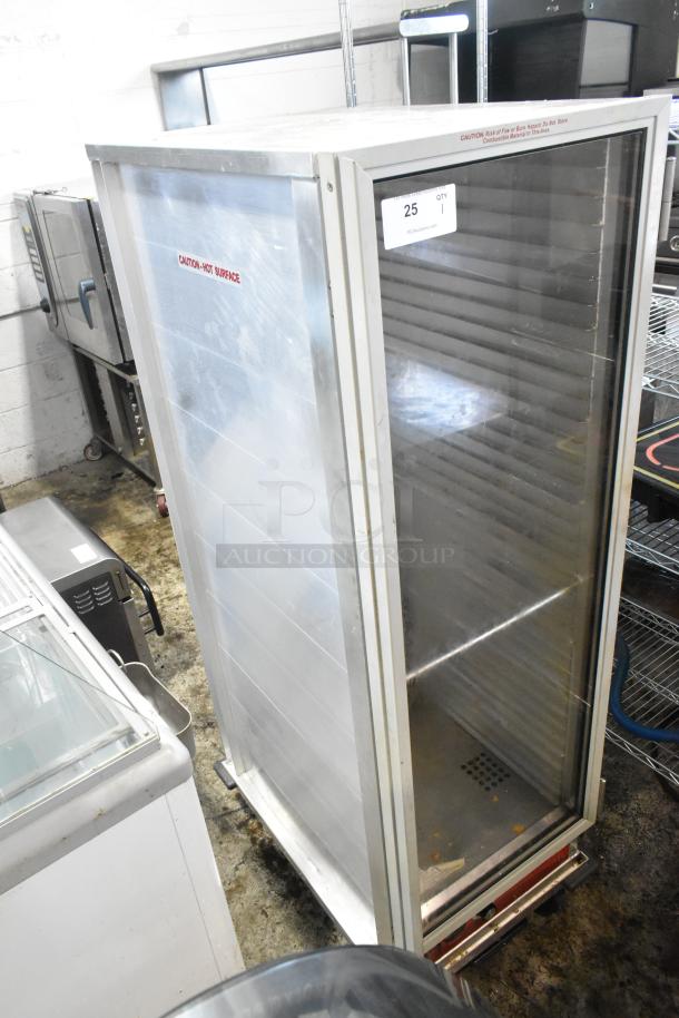 Avantco 177HEAT1836 metal commercial heated holding cabinet on casters, 120V, 1 phase, with caution labels, in good condition.