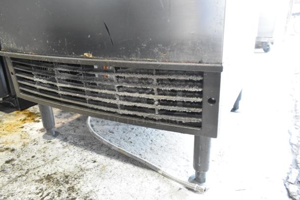 Manitowoc UY09190A-161B stainless steel ice machine showing vent and cord. Some dirt and wear visible. 115V, 1 phase.