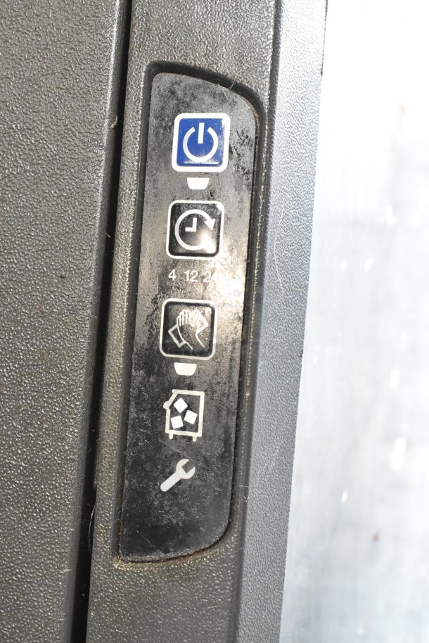 Control panel of the Manitowoc UY09190A-161B ice machine, showing power, timer, cleaning, and maintenance icons.