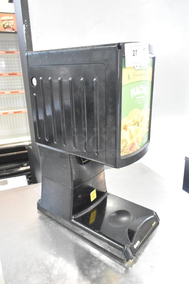 Hot Top HT2-01 countertop hot cheese dispenser, 120 volts, 1 phase. Black finish, visible nacho cheese packet inside. Appears in good condition.