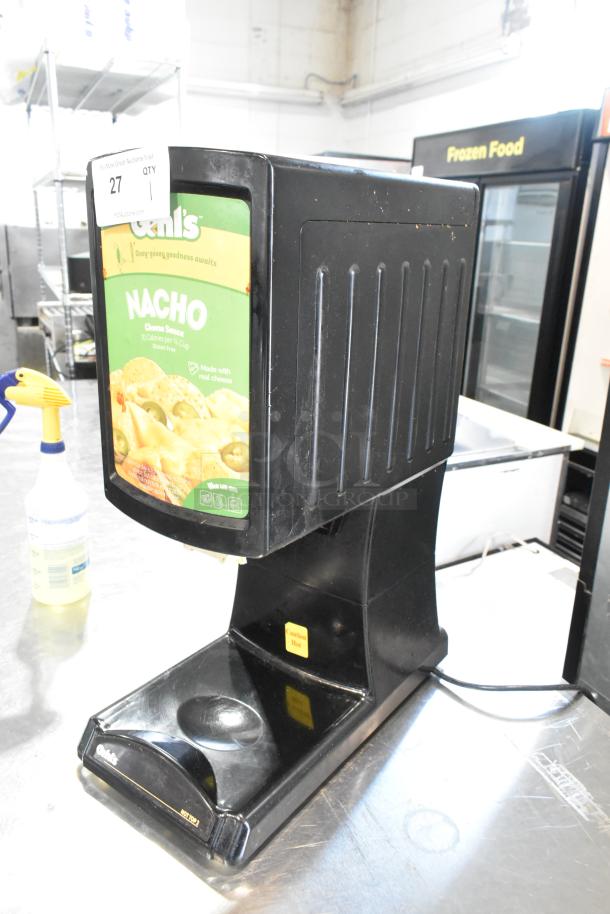 2023 Hot Top HT2-01 countertop hot cheese dispenser, black, 120 volts, single phase, good condition with nacho cheese label.