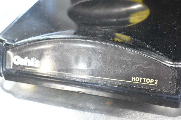 2023 Hot Top HT2-01 countertop hot cheese dispenser in black. Model label "HOT TOP 2" visible. Condition appears good.