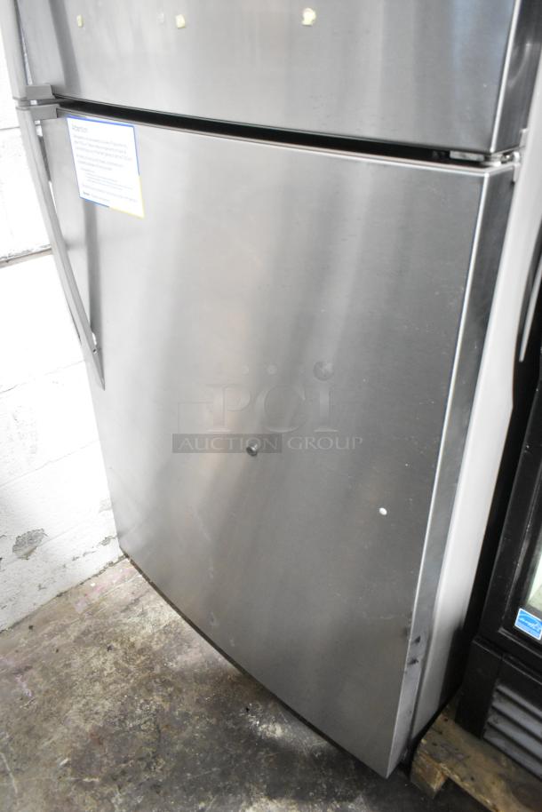 2016 Whirlpool WRT511SZDM00 stainless steel fridge-freezer, 115 volts, 1 phase, visible minor scuffs on surface.