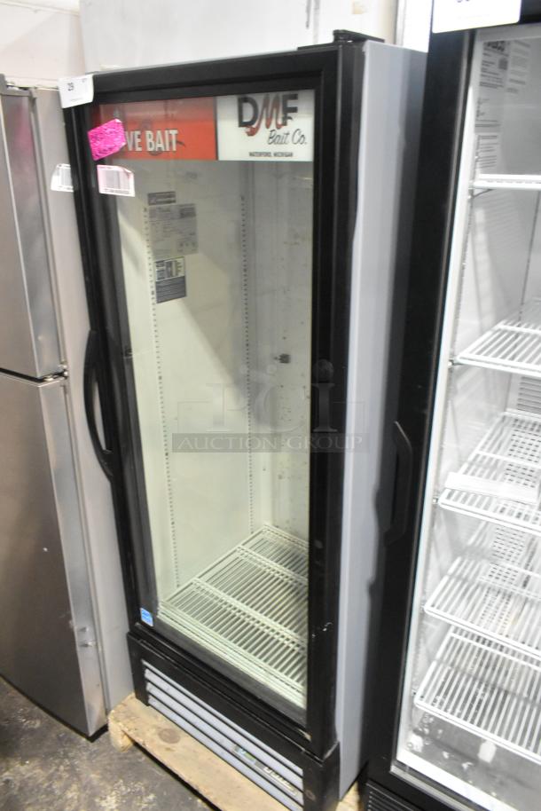 2023 True GDM-12-HC single door cooler merchandiser, metal, poly coated racks, 115V, 1 phase, visible labels inside.